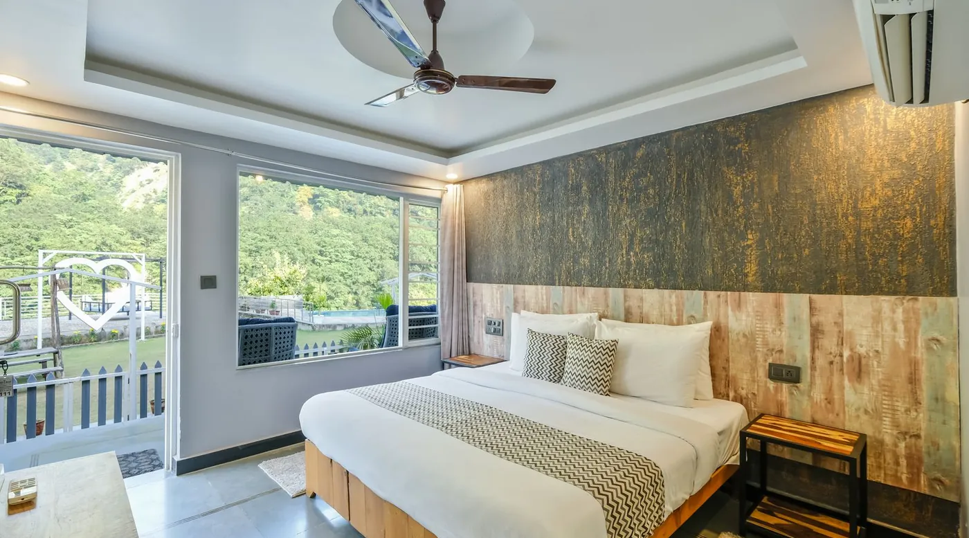 Modern bedroom with a ceiling fan, comparing the best bed cooling systems